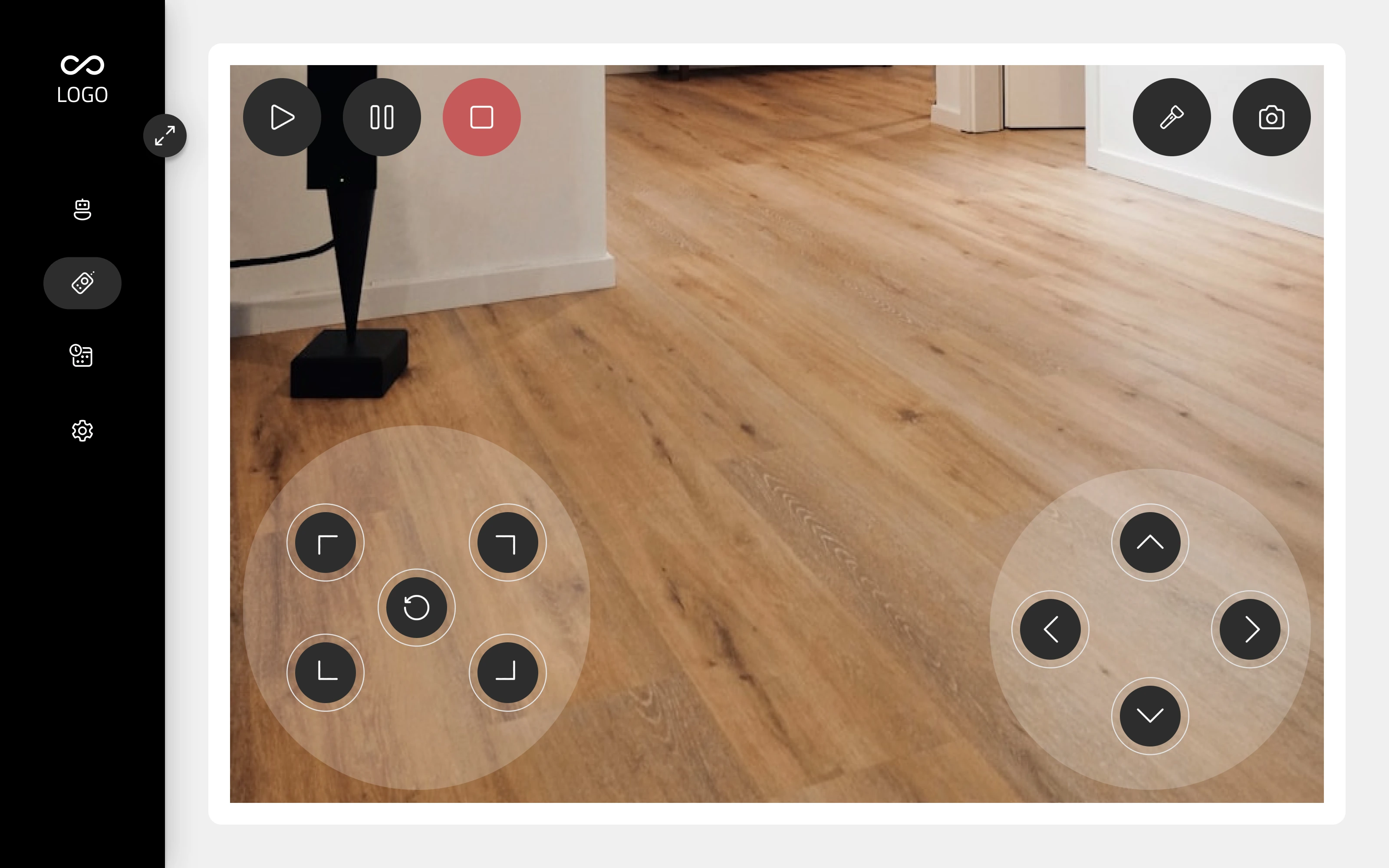 Manual control screen showing a live camera view from the bot, with movement and rotation pads overlaid and torch and capture controls